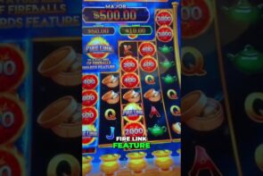 Casino slot machine fire link feature triggered, free game chase for big win.